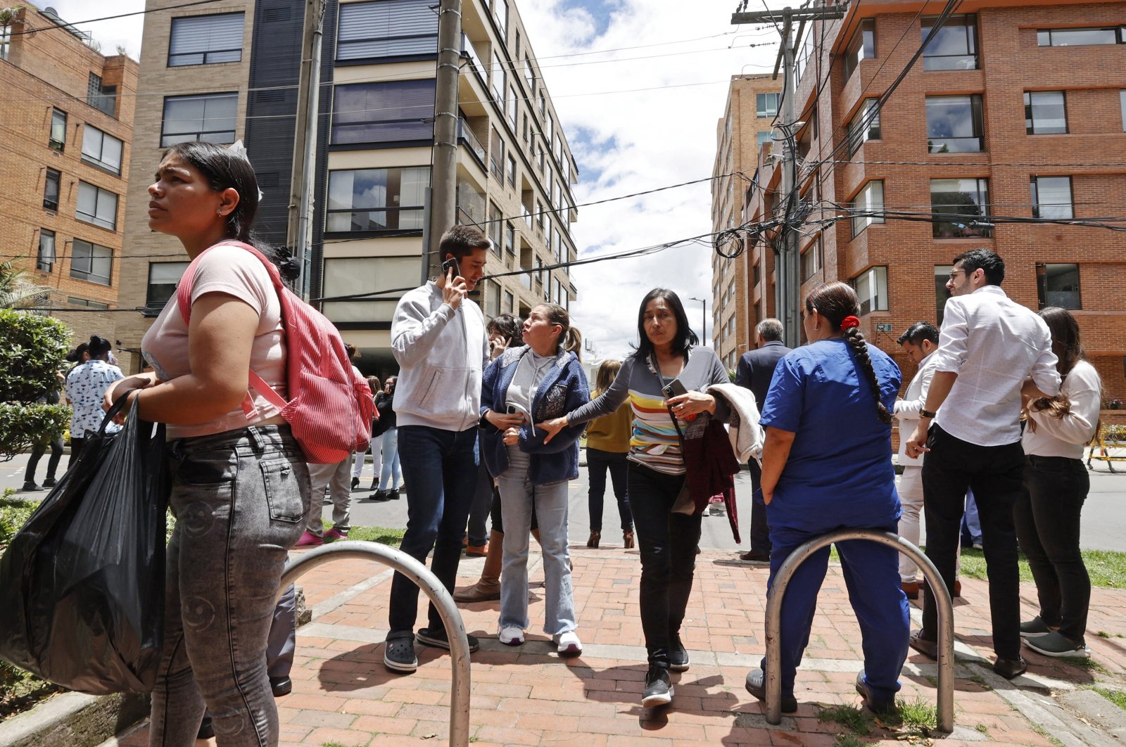 People stand on a street as they are evacuated from buildings after an earthquake shakes Bogota, Colombia, Aug. 17, 2023. (EPA Photo)