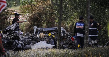 A forensic unit from the Royal Malaysia Police officers at the scene of the light aircraft crash in Elmina, Selangor, Malaysia, Aug. 17, 2023. (EPA Photo)