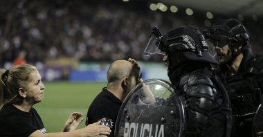 Slovenian police try to calm the chaos during the UEFA Europa Conference League 3rd round match between Maribor and Fenerbahçe, Maribor, Slovenia, Aug. 17, 2023. (AA Photo)