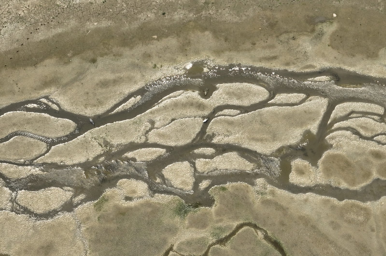 An aerial view of a local dam is seen dried amid all-time high evaporation, Istanbul, Türkiye, Aug. 18, 2023. (IHA Photo)