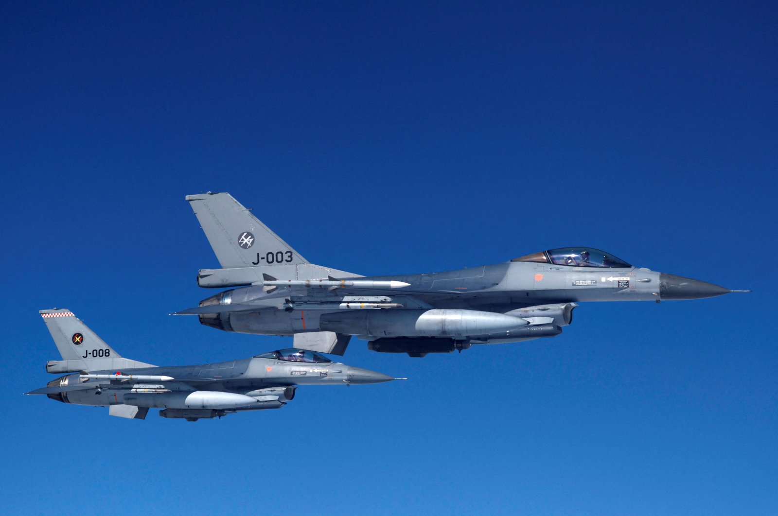 Netherlands&#039; Air Force F-16 fighter jets fly alongside an aircraft simulating aerial interceptions during a media day illustrating how NATO Air Policing safeguards the Allies&#039; airspace in the northern and northeastern region of the alliance, July 4, 2023. (Reuters Photo)