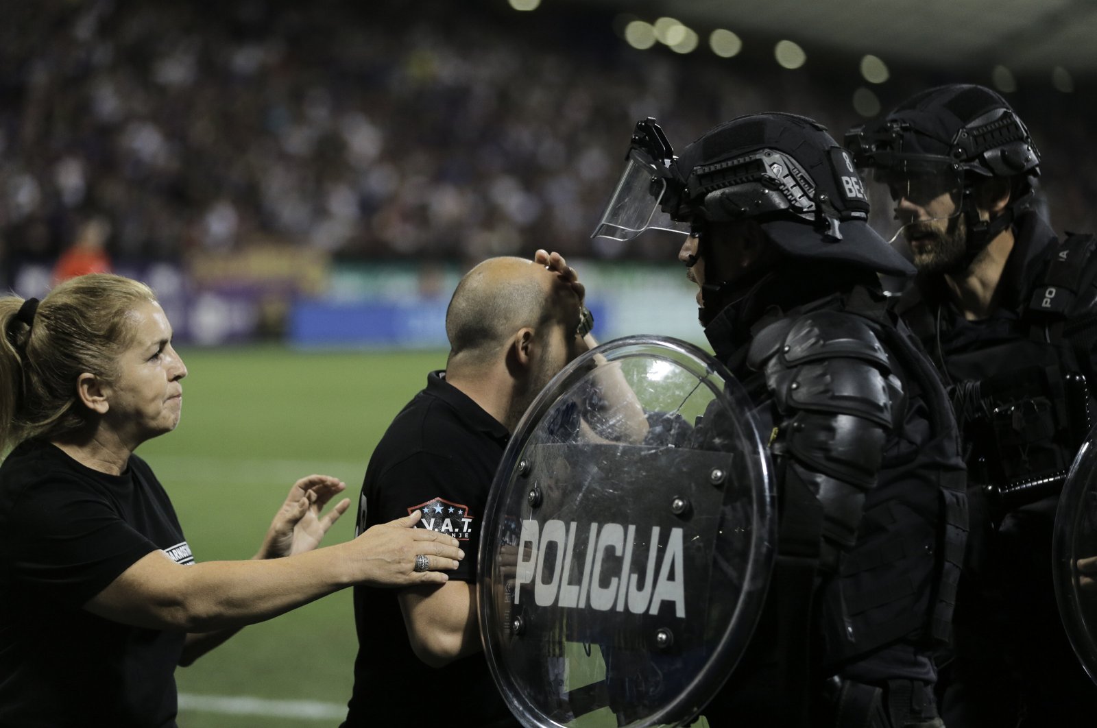 Slovenian police try to calm the chaos during the UEFA Europa Conference League 3rd round match between Maribor and Fenerbahçe, Maribor, Slovenia, Aug. 17, 2023. (AA Photo)