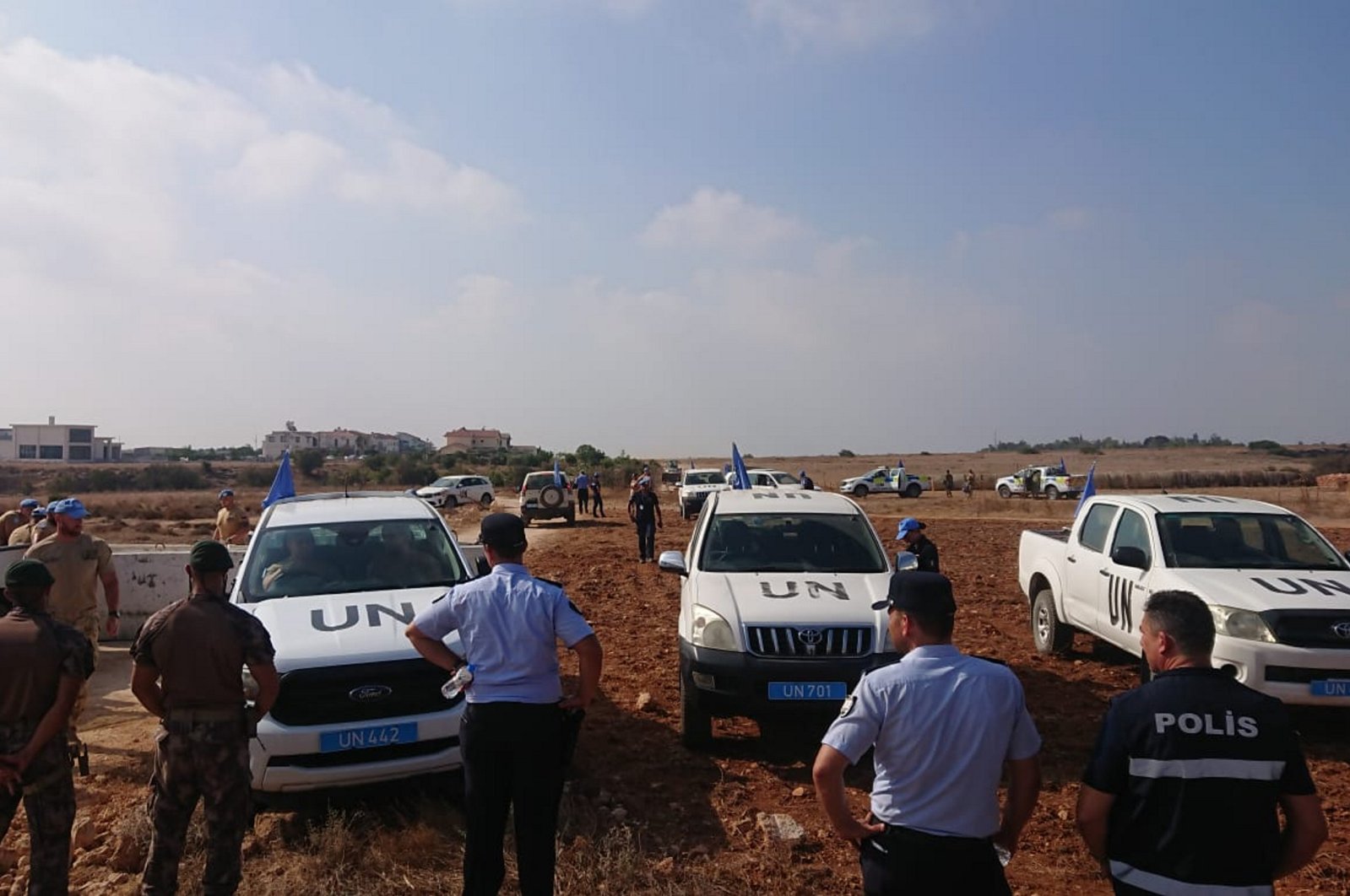U.N. vehicles, police are seen on the Pile-Yiğitler road project in the Turkish Republic of Northern Cyprus (TRNC), Friday, Aug. 18, 2023. (AA Photo)