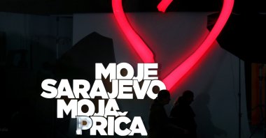 People walk in front of a poster that reads &quot;My Sarajevo, My Story&quot; during the closing of the 29th Sarajevo Film Festival in Sarajevo, Bosnia and Herzegovina, Aug. 18, 2023. (EPA Photo)