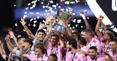 Inter Miami's Lionel Messi hoists the trophy with his teammates after defeating Nashville SC to win the Leagues Cup 2023 final at GEODIS Park, Nashville, U.S., Aug. 19, 2023. (Getty Images Photo)