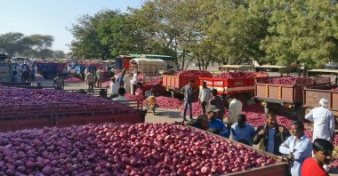 Farmers wait for the auction of onions at Lasalgaon market in Nashik district in the western state of Maharashtra, India, Dec. 19, 2018. (Reuters Photo)