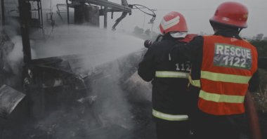 Rescuers work after a bus crashed and caught fire in Pindi Bhattian, Punjab, Pakistan, Aug. 20, 2023. (Reuters Photo)