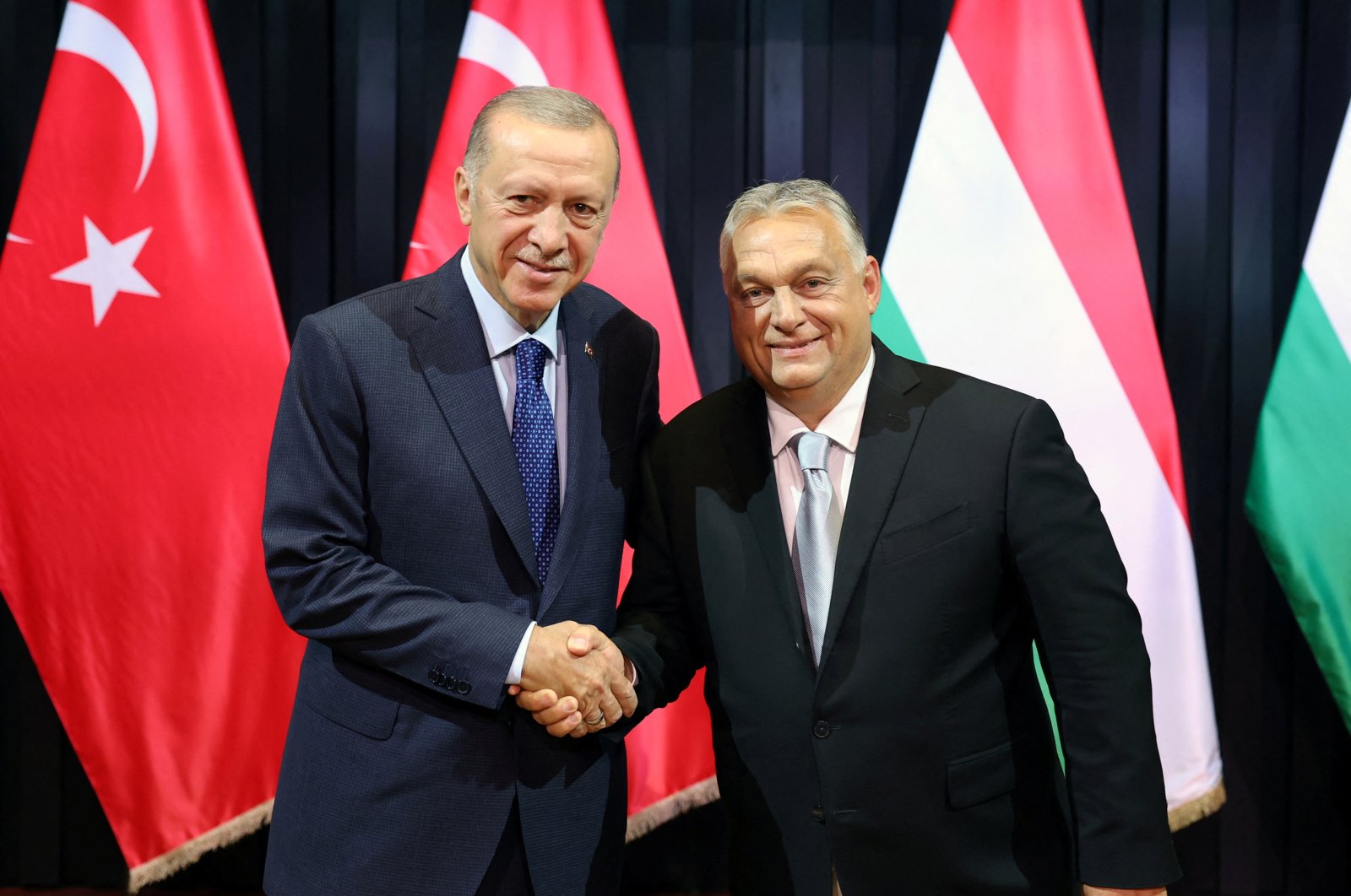President Recep Tayyip Erdoğan (L) shakes hands with Hungarian Prime Minister Viktor Orban, in Budapest, Hungary, Aug. 20, 2023. (Reuters Photo)