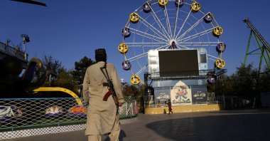 A Taliban fighter stands guard in an amusement park in Kabul, Afghanistan, Nov. 10, 2022. (AP File Photo)