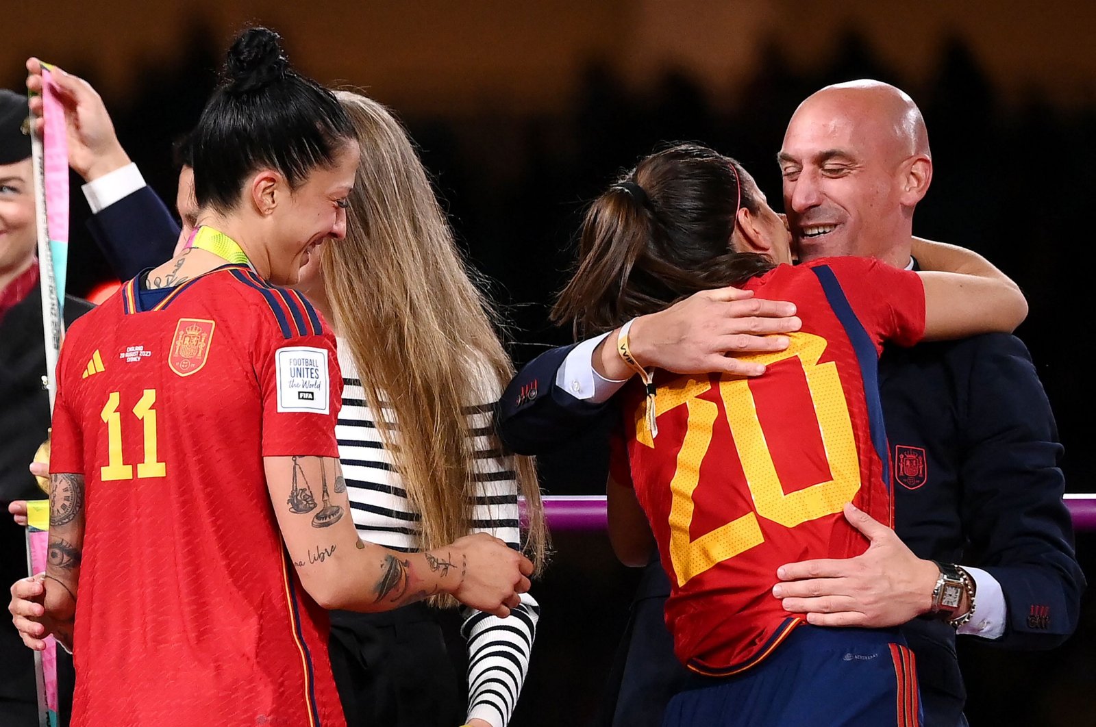 Spain&#039;s defender (2nd R) Rocio Galvez is congratulated by Royal Spanish Football Federation President Luis Rubiales (R) next to Jennifer Hermoso after winning the Women&#039;s World Cup final football match against England at Stadium Australia, Sydney, Australia, Aug. 20, 2023. (AFP Photo)