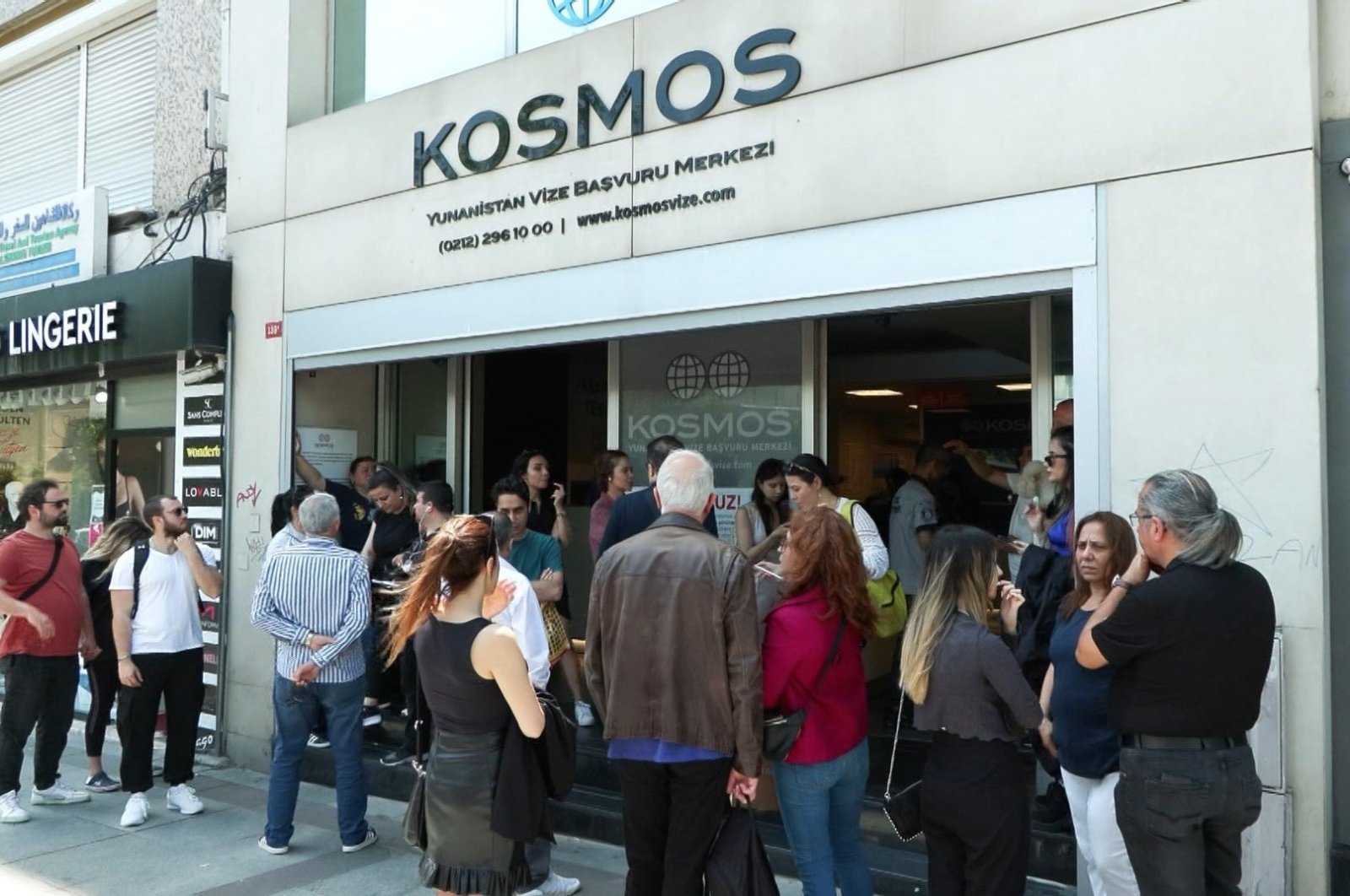 People wait outside a visa application center in Istanbul, Türkiye, June 1, 2023. (DHA Photo)