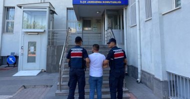 Gendarmerie officers escort a captured FETÖ suspect in Kayseri, central Türkiye, Aug. 18, 2023. (IHA Photo)