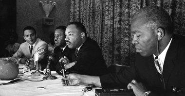 Rev. Martin Luther King, (C) speaks with the media at the Southern Christian Leadership Conference convention in Savannah, Georgia, U.S., Sept. 29, 1964. (AP Photo)