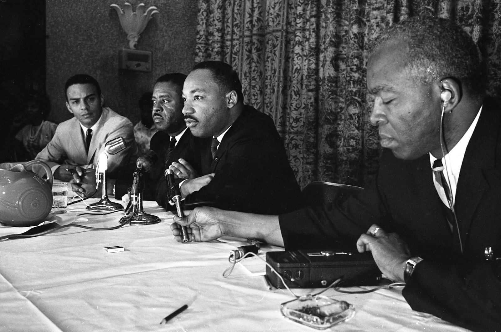Rev. Martin Luther King, (C) speaks with the media at the Southern Christian Leadership Conference convention in Savannah, Georgia, U.S., Sept. 29, 1964. (AP Photo)