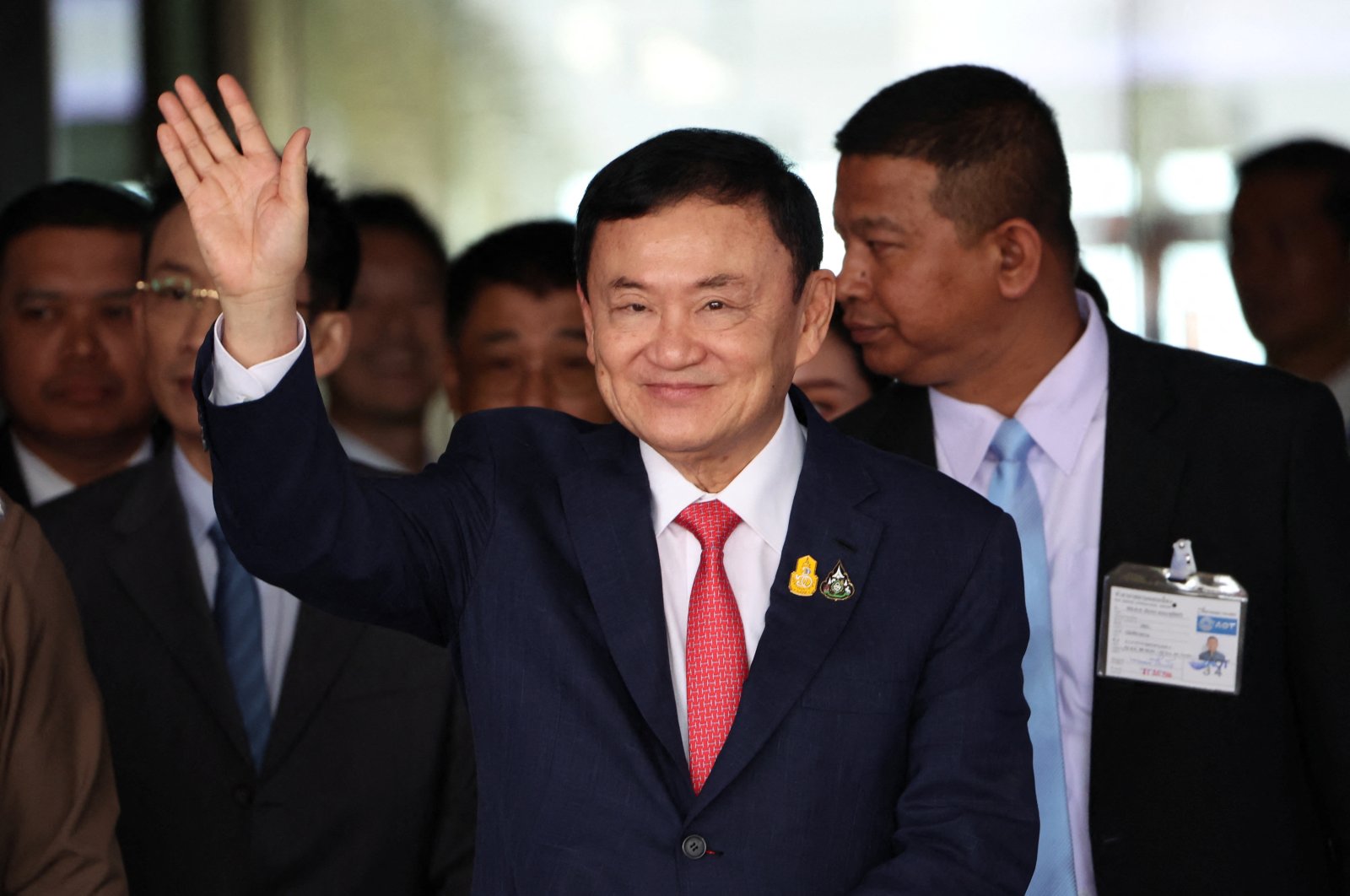 Former Thai Prime Minister Thaksin Shinawatra, who is expected to be arrested upon his return as he ends almost two decades of self-imposed exile, waves at Don Mueang airport, Bangkok, Thailand, Aug. 22, 2023. (Reuters Photo)