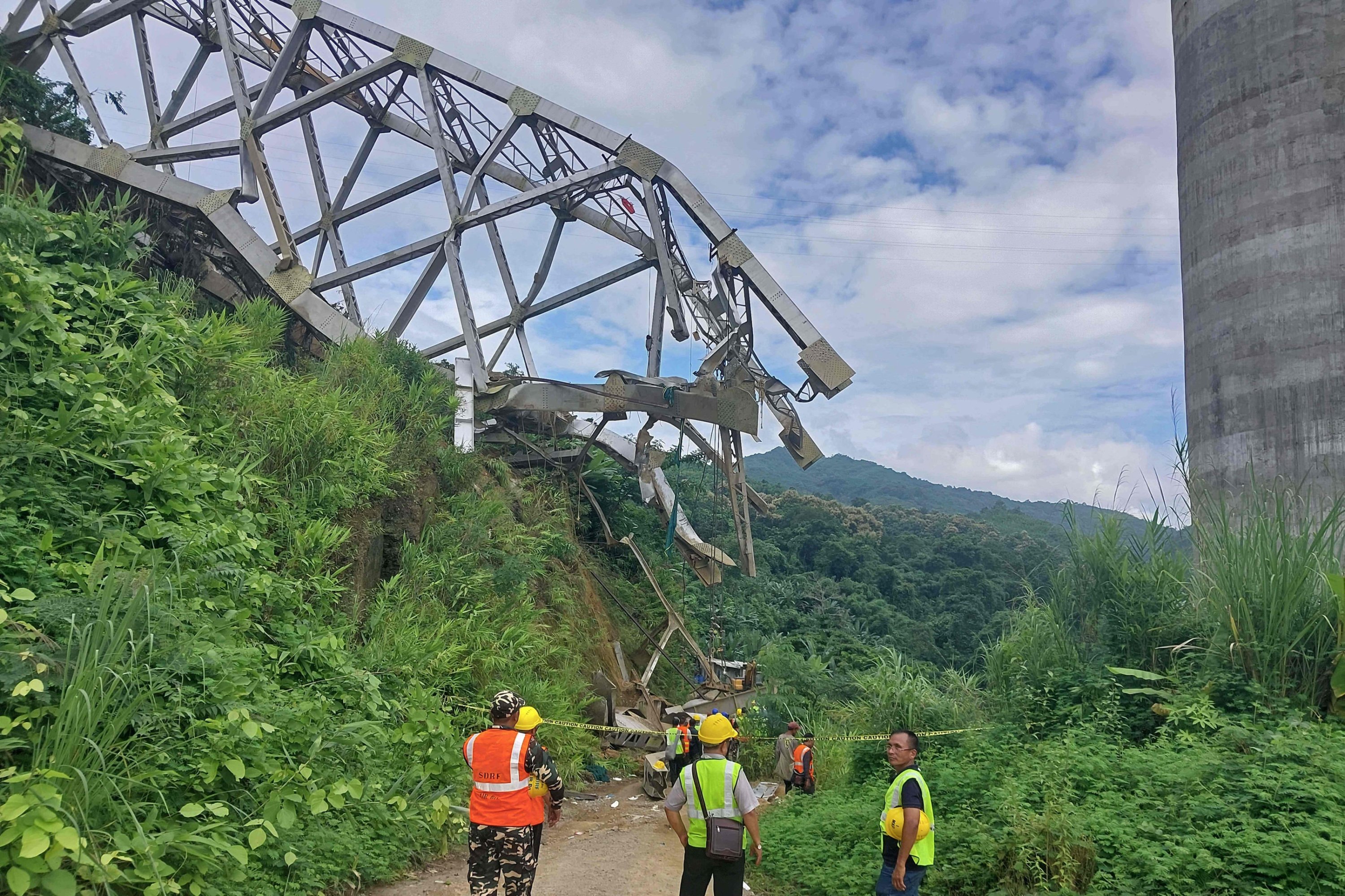 Rescue workers conduct a search operation at the site of the accident in Sairang, northeastern India, Aug. 23, 2023. (AFP Photo)