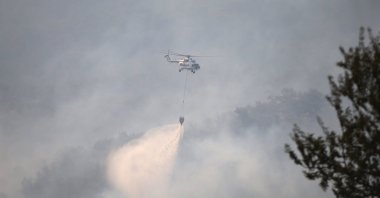 Efforts continue to extinguish the fire, which broke out in the forest area near the Ulupınar village, Çanakkale, Türkiye, Aug. 23, 2023. (AA Photo)