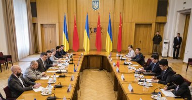 Ukrainian Foreign Minister Dmytro Kuleba (L-C) and Li Hui, Chinese envoy (C-R), during their talks in Kyiv, Ukraine, May 17, 2023. (AP Photo)
