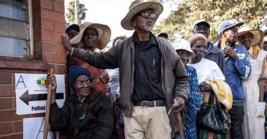 Voters queue outside a polling station during Zimbabwe's presidential and legislative elections, Harare, Zimbabwe, Aug. 23, 2023. (AFP Photo)