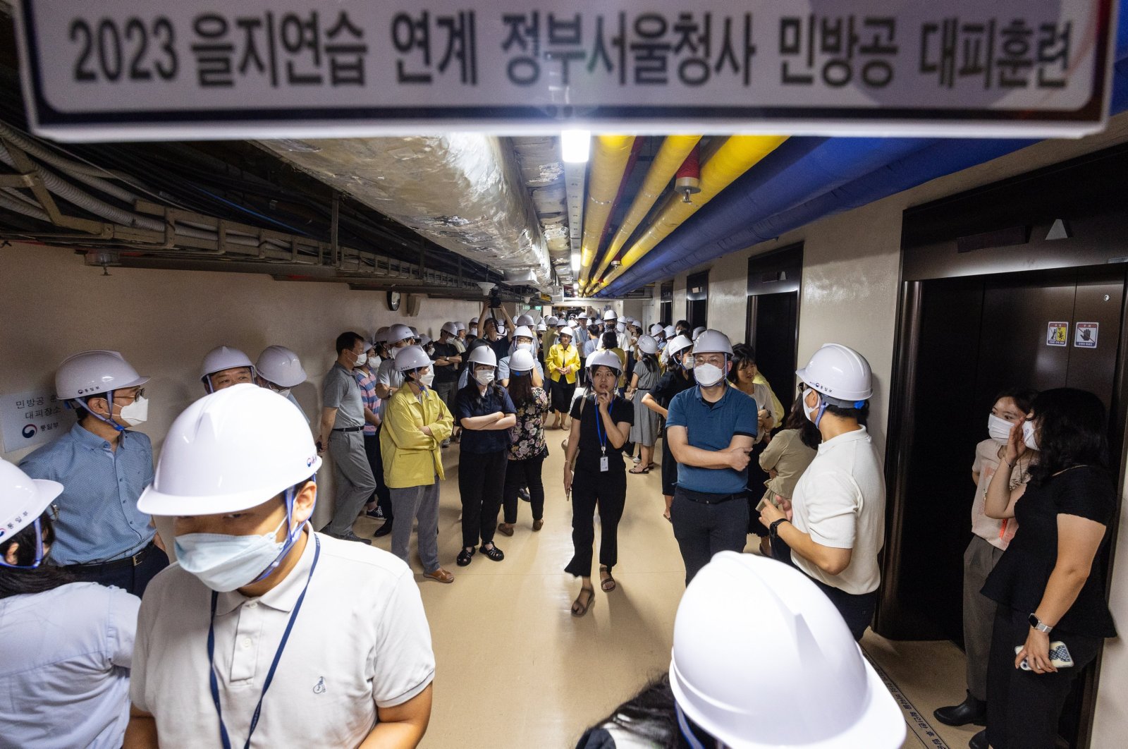 Government officials shelter at the government complex after a civil defense siren went off across the country with vehicles on designated roads to be ordered to pull over and people to evacuate to shelters or underground facilities, Seoul, South Korea, Aug. 23, 2023. (EPA Photo)