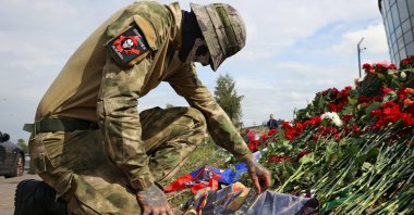 A fighter of Wagner private mercenary group visits a makeshift memorial near the Wagner Group HQ in St. Petersburg, Russia, Aug. 24, 2023. (Reuters Photo)