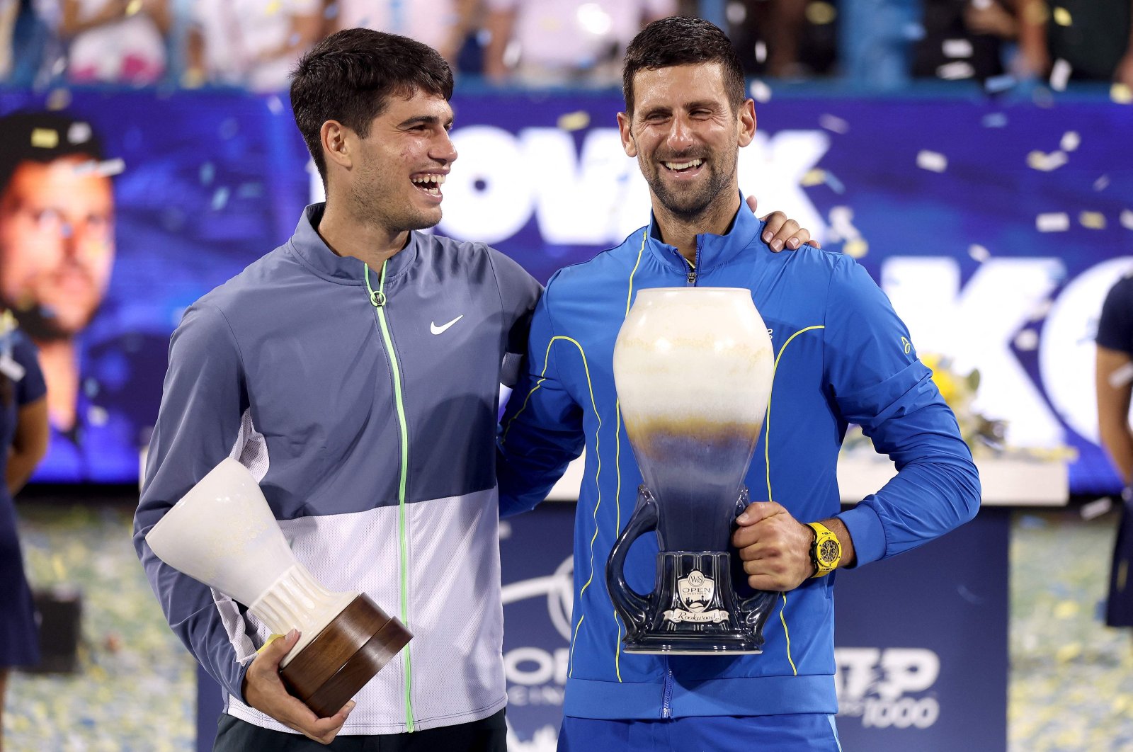 Spain&#039;s Carlos Alcaraz (L) and Serbia&#039;s Novak Djokovic pose with their trophies after the final of the Western & Southern Open at Lindner Family Tennis Center, Ohio, US., Aug. 20, 2023. (AFP Photo)
