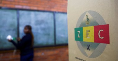 A ballot box is seen as a worker cleans a chalk board, ahead of the presidential elections in Warren Park, Harare, Zimbabwe, Aug. 22 2023. (Reuters Photo)