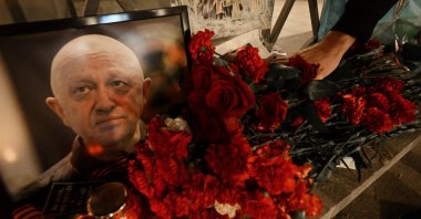A man lays flowers at the makeshift memorial in honor of Yevgeny Prigozhin, in Moscow, Russia, Aug. 24, 2023. (AFP Photo)
