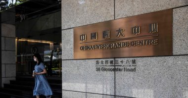 A woman leaves the China Evergrande Centre in Hong Kong, China, July 28, 2022. (AFP Photo)