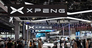 People visit the XPeng booth during the 20th Shanghai International Automobile Industry Exhibition in Shanghai, China, April 19, 2023. (AFP Photo)