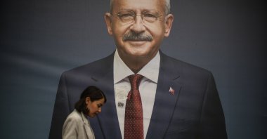 A woman walks past a billboard of main opposition Republican People's Party (CHP) chair Kemal Kılıçdaroğlu a day after the presidential election day in Istanbul, Türkiye, May 29, 2023. (AP Photo)