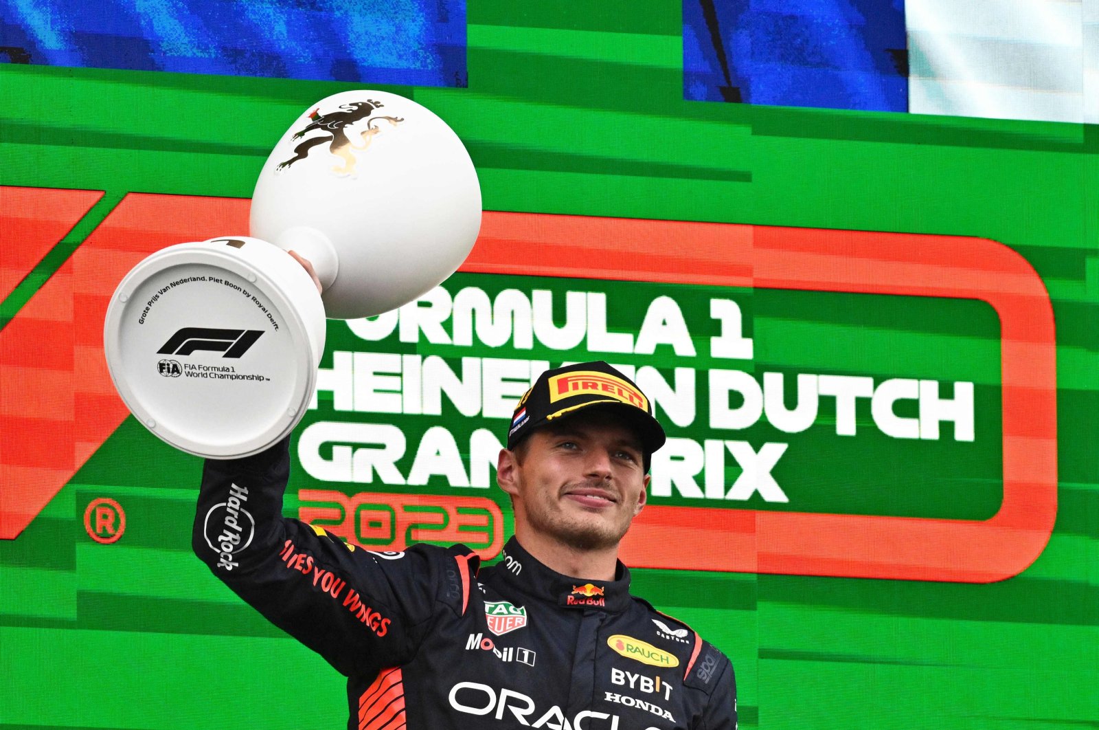 Red Bull Racing&#039;s Dutch driver Max Verstappen celebrates with the trophy on the podium after winning the Dutch Formula One Grand Prix race at The Circuit Zandvoort, Zandvoort, Netherlands, Aug. 27, 2023. (AFP Photo)