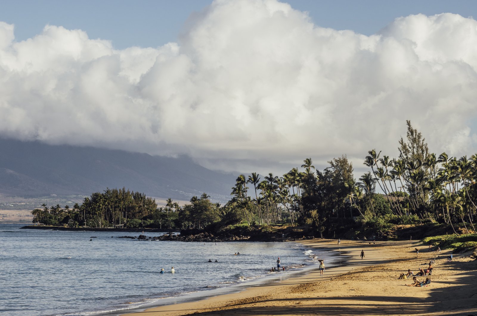 Beachgoers at Kamaole Beach Park I in Kihei on the island of Maui, Hawaii, Aug. 18, 2023. (AP Photo)