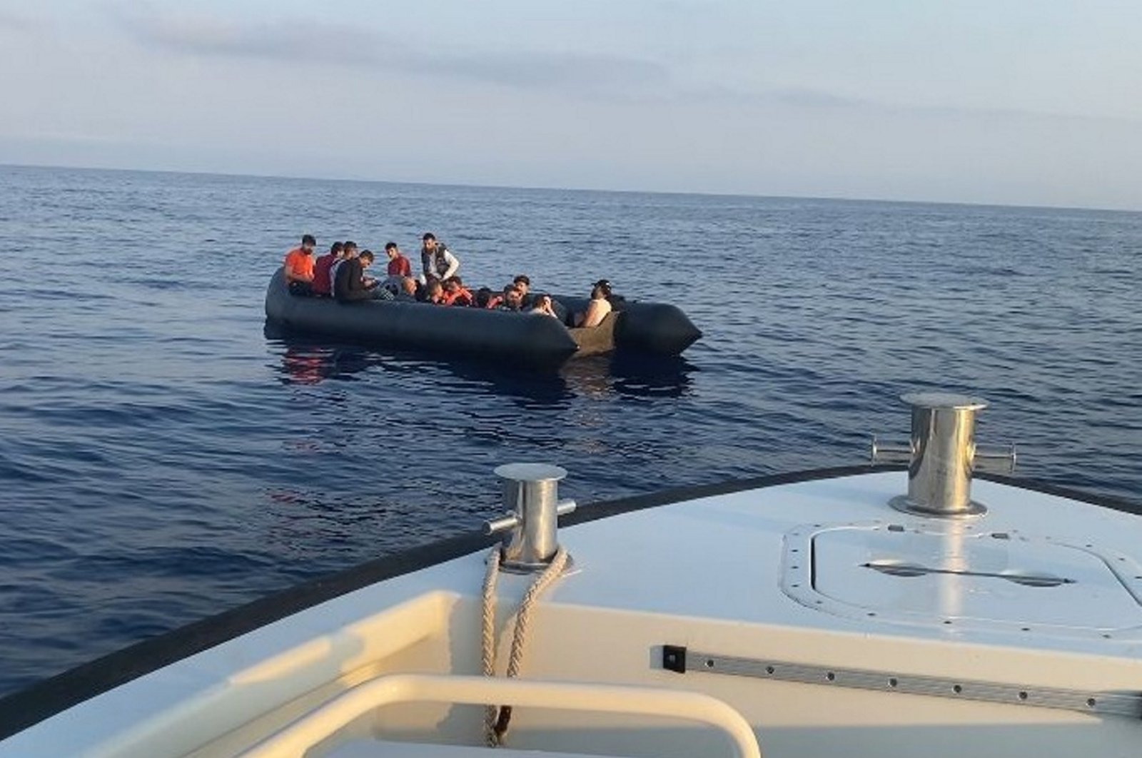 Turkish coast guard comes to the rescue of 42 irregular migrants on rubber boats pushed back by Greece into Turkish territorial waters off the coast of western Muğla province, Türkiye, Aug. 27, 2023. (AA Photo)