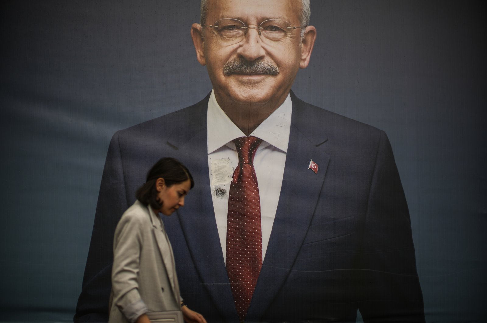 A woman walks past a billboard of main opposition Republican People&#039;s Party (CHP) chair Kemal Kılıçdaroğlu a day after the presidential election day in Istanbul, Türkiye, May 29, 2023. (AP Photo)