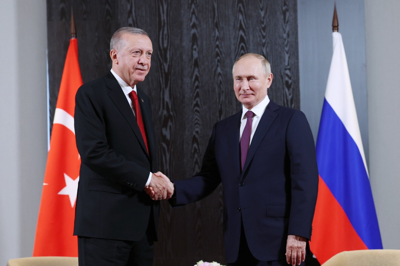 President Recep Tayyip Erdoğan shakes hands with Russian President Vladimir Putin during a meeting in Samarkand, Uzbekistan, Sept. 18, 2022. (IHA Photo)
