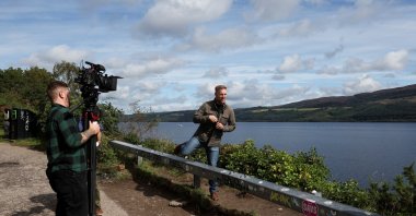 Members of the media work near Loch Ness as people take part in the largest Loch Ness Monster hunt in 50 years in Scotland, U.K., Aug. 27, 2023. (Reuters)