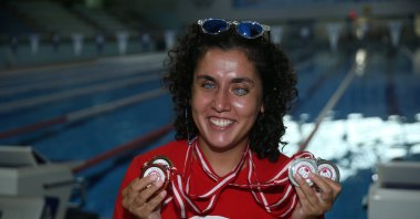 Turkish swimmer, Zeynep Yılmaz poses for a photo with her medals, Ordu, Türkiye, Aug. 22, 2023. (AA Photo)