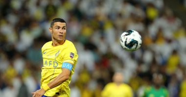 Nassr's Portuguese forward Cristiano Ronaldo eyes the ball during the 2023 Arab Club Champions Cup semifinal football match between Saudi Arabia's Al-Nassr and Iraq's Al-Shorta at Prince Sultan bin Abdul Aziz Stadium, Abha, Saudi Arabia, Aug. 9, 2023. (AFP Photo)