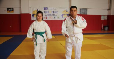 Turkish judokas with Down syndrome Muhammed Demirbaş (R) and Sibel Yıldırım pose for a photo after training, Kilis, Türkiye, Aug. 16, 2023 (AA Photo)