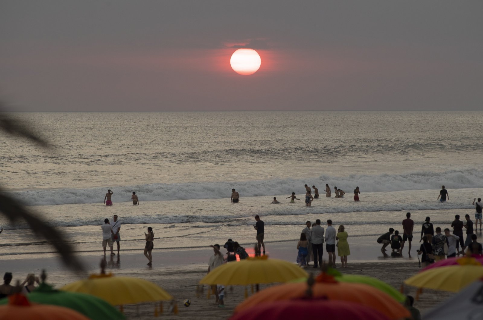 Foreign tourists gather at a beach in Seminyak, Bali, Indonesia, Aug. 1, 2023. (EPA Photo)