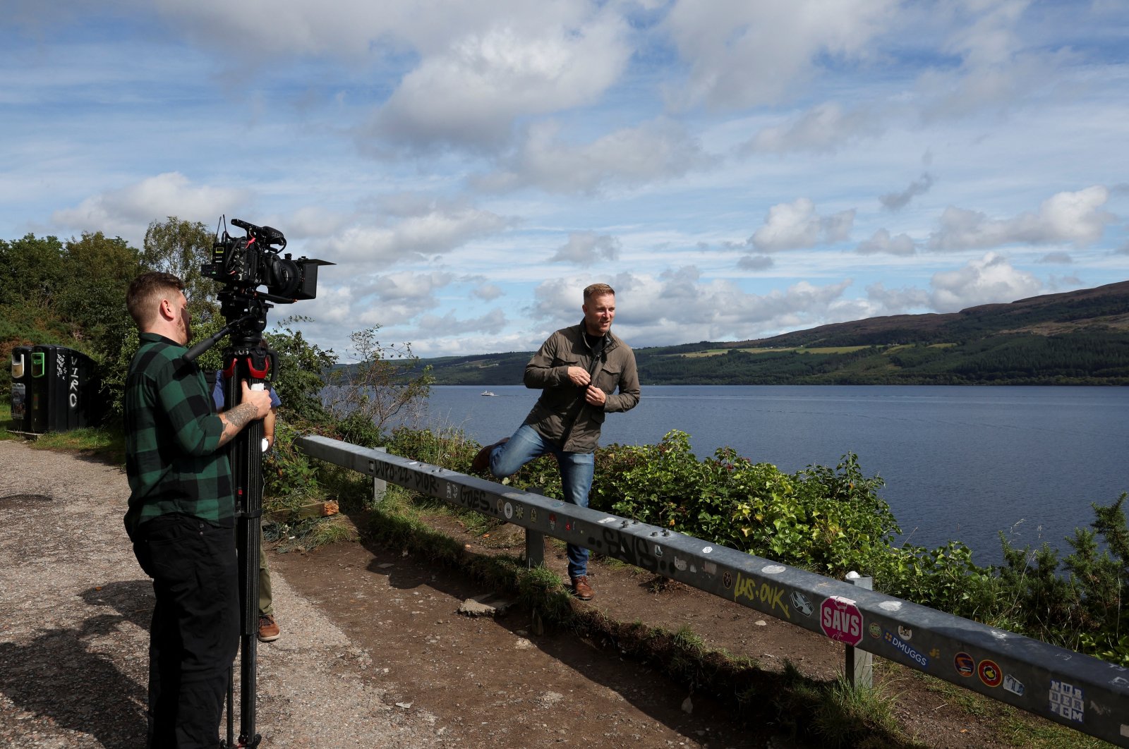 Members of the media work near Loch Ness as people take part in the largest Loch Ness Monster hunt in 50 years in Scotland, U.K., Aug. 27, 2023. (Reuters)