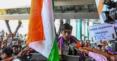 India&#039;s chess grandmaster and silver medallist Rameshbabu Praggnanandhaa, responds to a television media personnel as he is welcomed upon his return from the FIDE Chess World Cup in Baku, at the Chennai International airport, Chennai, India, Aug. 30, 2023. (AFP Photo)