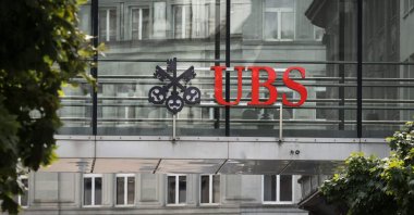 A sign of Swiss giant banking UBS is seen above a sign of Credit Suisse in Zurich, Switzerland, Aug. 30, 2023. (AFP Photo)