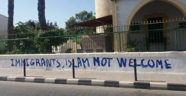 The garden wall of the Köprülü Hacı Ibrahim Ağa Mosque reads "Immigrants, Islam not welcome" in spray paint after a perpetrator attacked the mosque, in Limassol, Greek Cyprus, Aug. 26, 2023. (AA Photo)