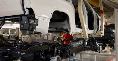A worker uses a robot to place a Tundra body onto its frame at Toyota's truck plant in San Antonio, Texas, U.S., April 17, 2023. (Reuters Photo)