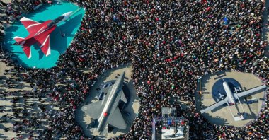 In this undated photo, the strong enthusiasm of the crowd towards domestically produced aircraft like the Bayraktar TB2 (R), Kızılelma (2nd L), and Hürjet (L) is seen. (AA Photo)