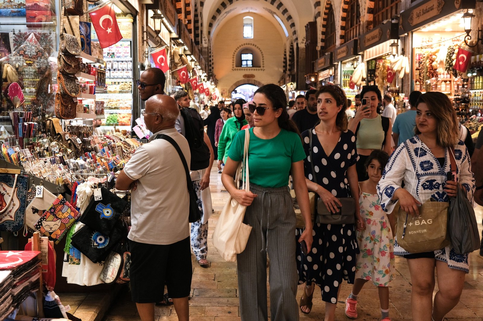 People shop at the Spice Bazaar in Istanbul, Türkiye,  August 2023. (EPA Photo)