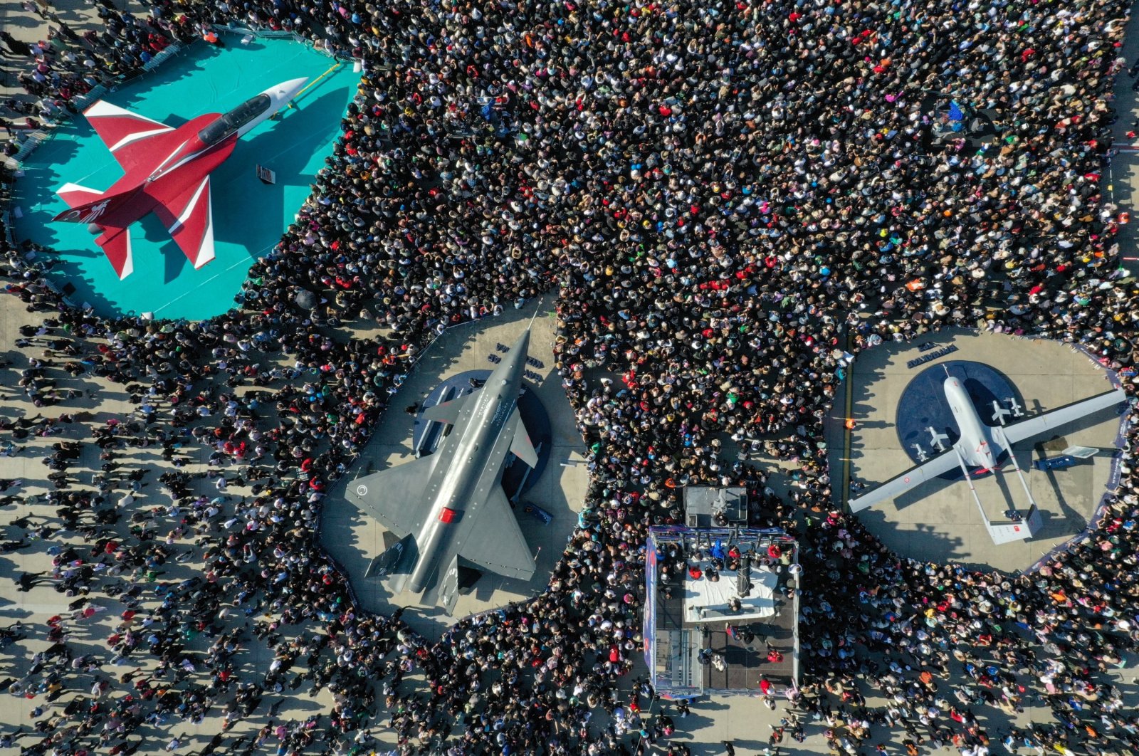 In this undated photo, the strong enthusiasm of the crowd towards domestically produced aircraft like the Bayraktar TB2 (R), Kızılelma (2nd L), and Hürjet (L) is seen. (AA Photo)
