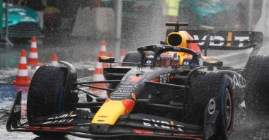 Red Bull Racing's Dutch driver Max Verstappen drives to the pit under the rain as the race is stopped during the Dutch Formula One Grand Prix race at The Circuit Zandvoort, Zandvoort, Netherlands, Aug. 27, 2023. (AFP Photo)